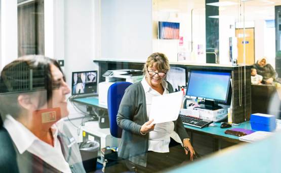 Receptionists in a healthcare centre reception